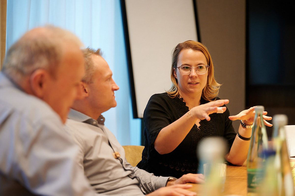 Barbara Zelenay working with colleagues during a transformation